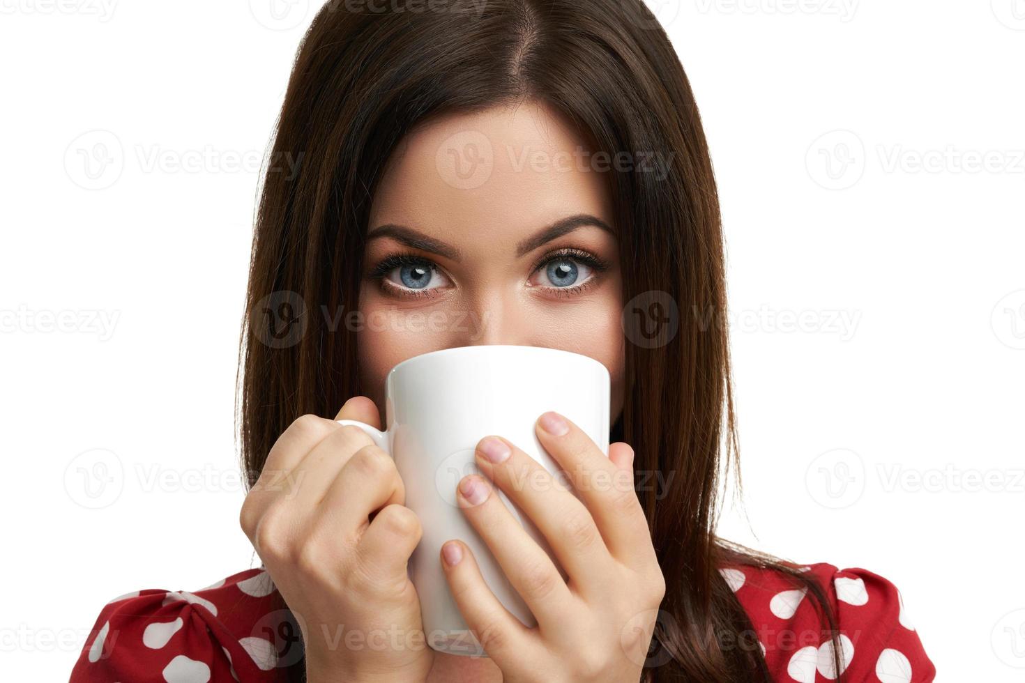 Caucasian brunette woman with mug of coffee isolated over white background photo