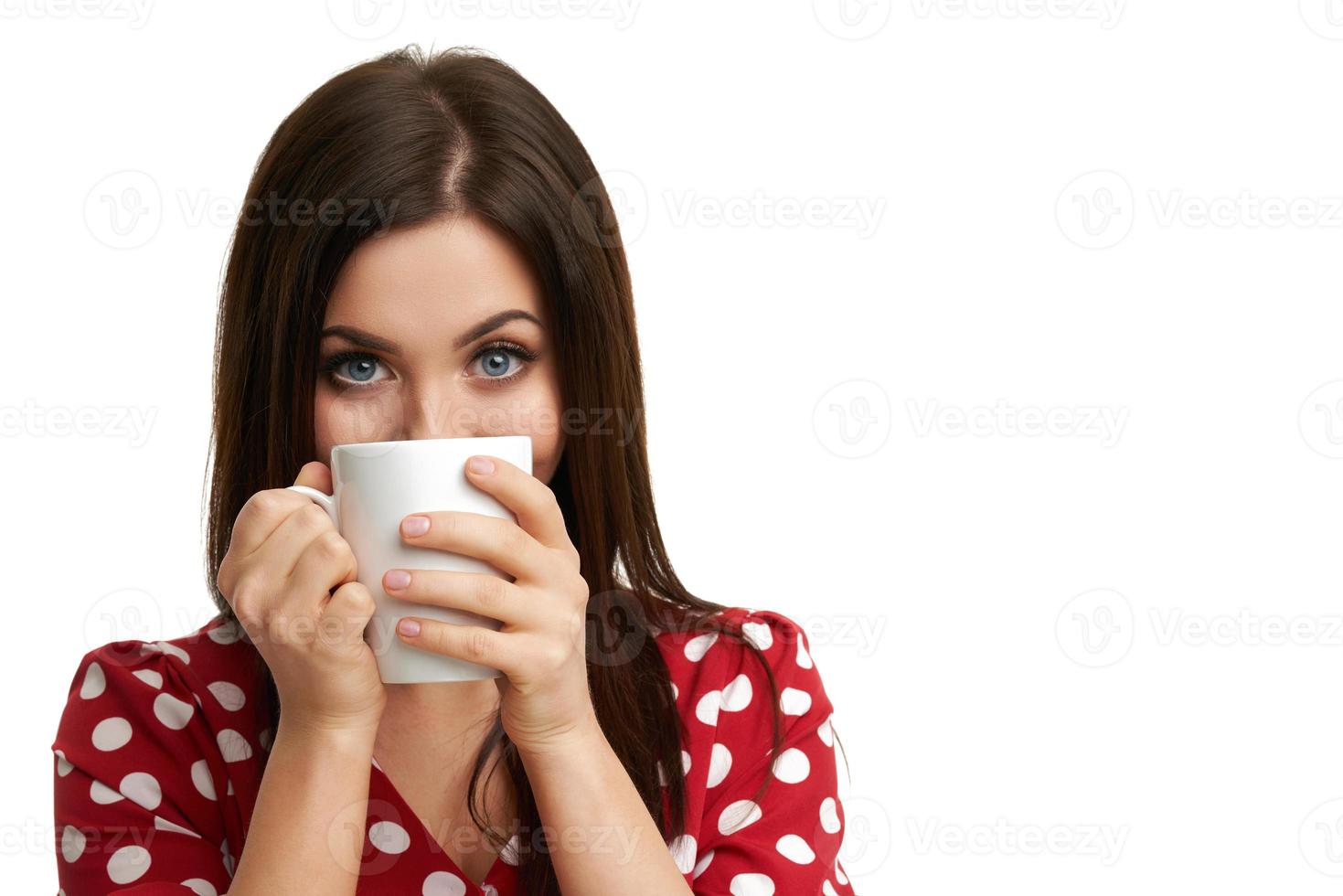 Caucasian brunette woman with mug of coffee isolated over white background photo