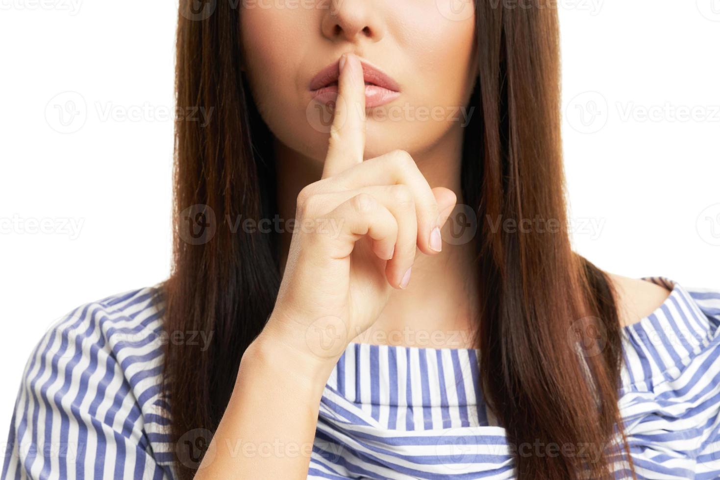 Shocked girl covers her face with hands isolated on white photo