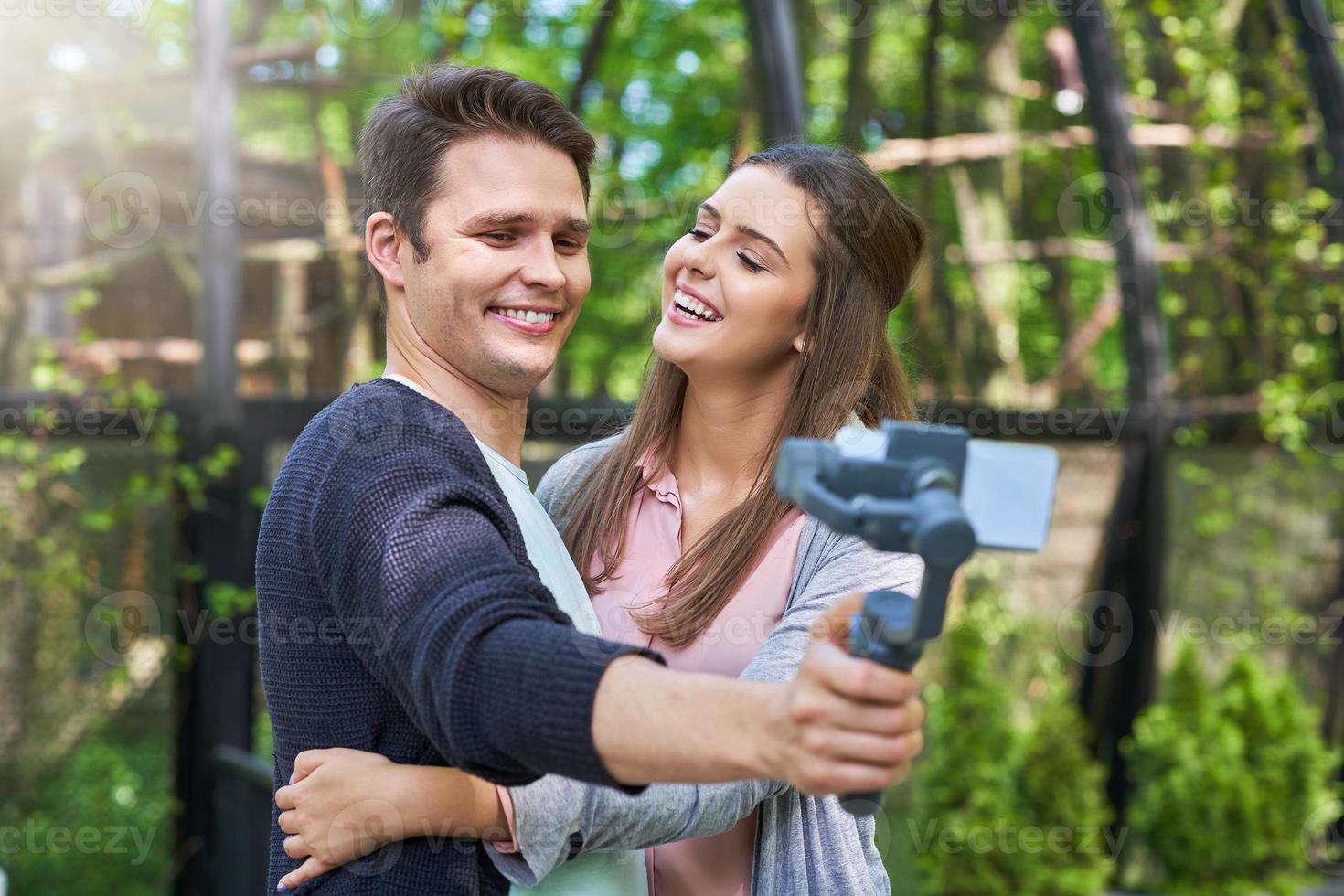 Couple of tourists taking pictures photo