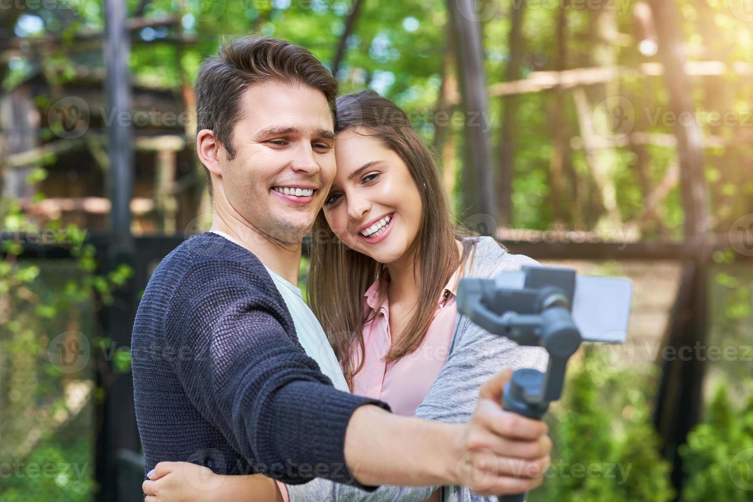 Couple of tourists taking pictures photo