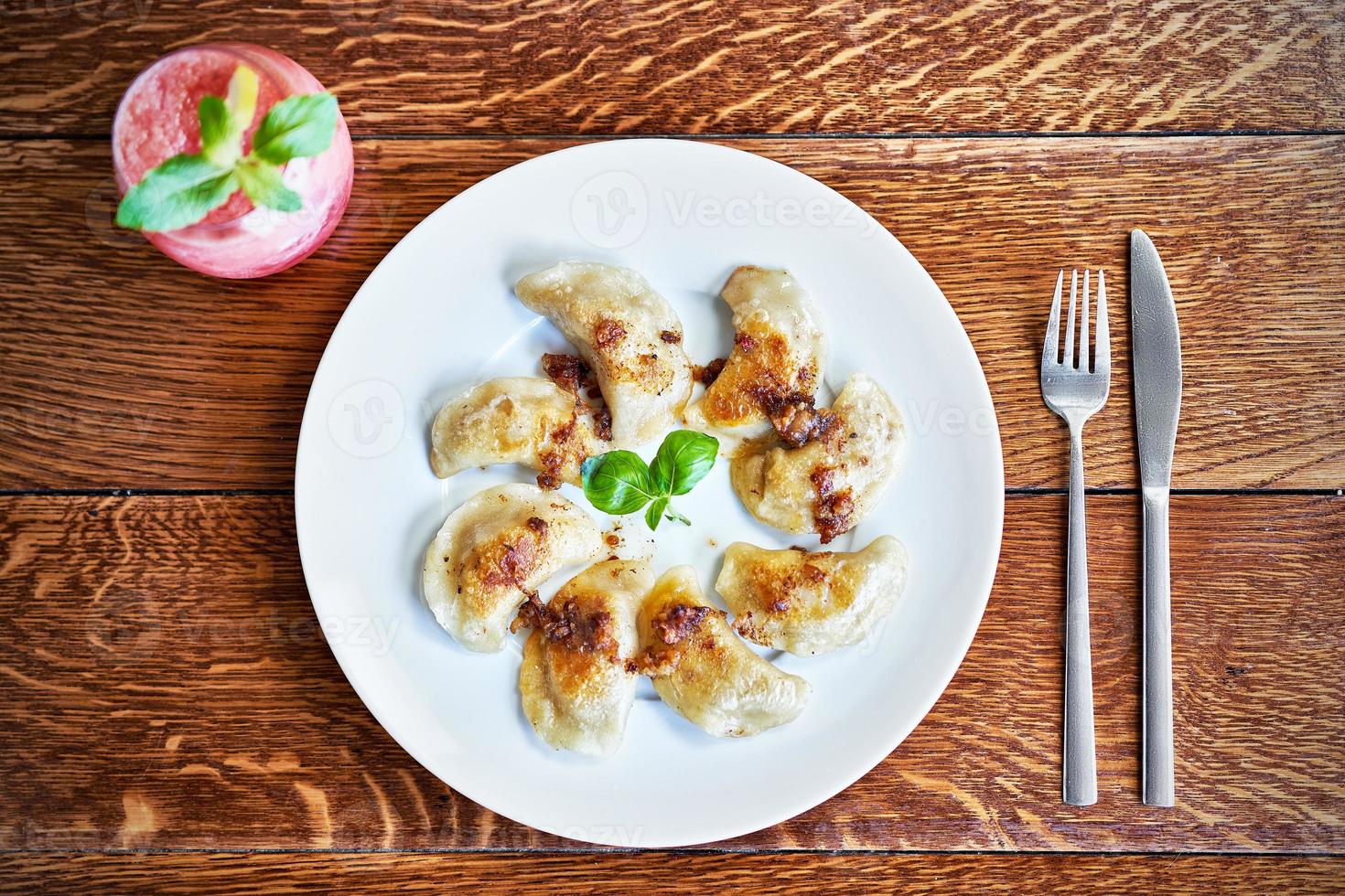 Fresh dumplings served on white plate photo