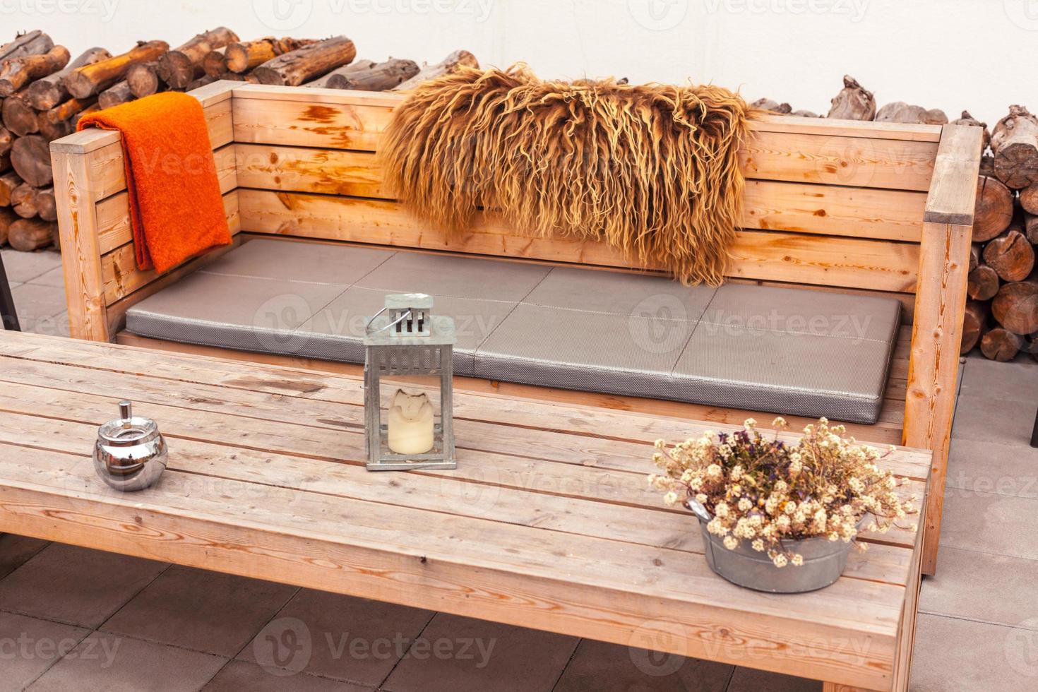 Outdoor restaurant terrace with wooden furniture photo