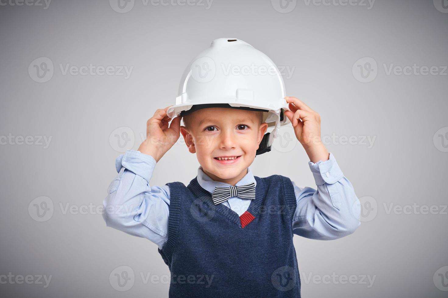 Portrait of a 4 year old boy posing over white photo