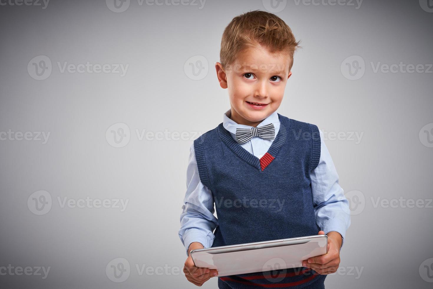 Portrait of a 4 year old boy posing over white photo
