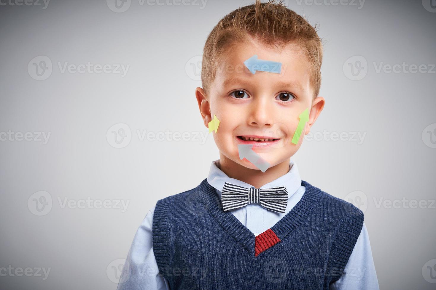 Portrait of a 4 year old boy posing over white with arrows photo