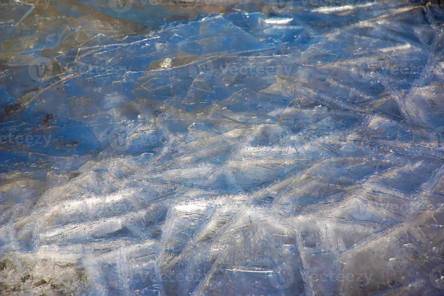 Ice surface of the river. Texture of ice shards. Winter background. photo