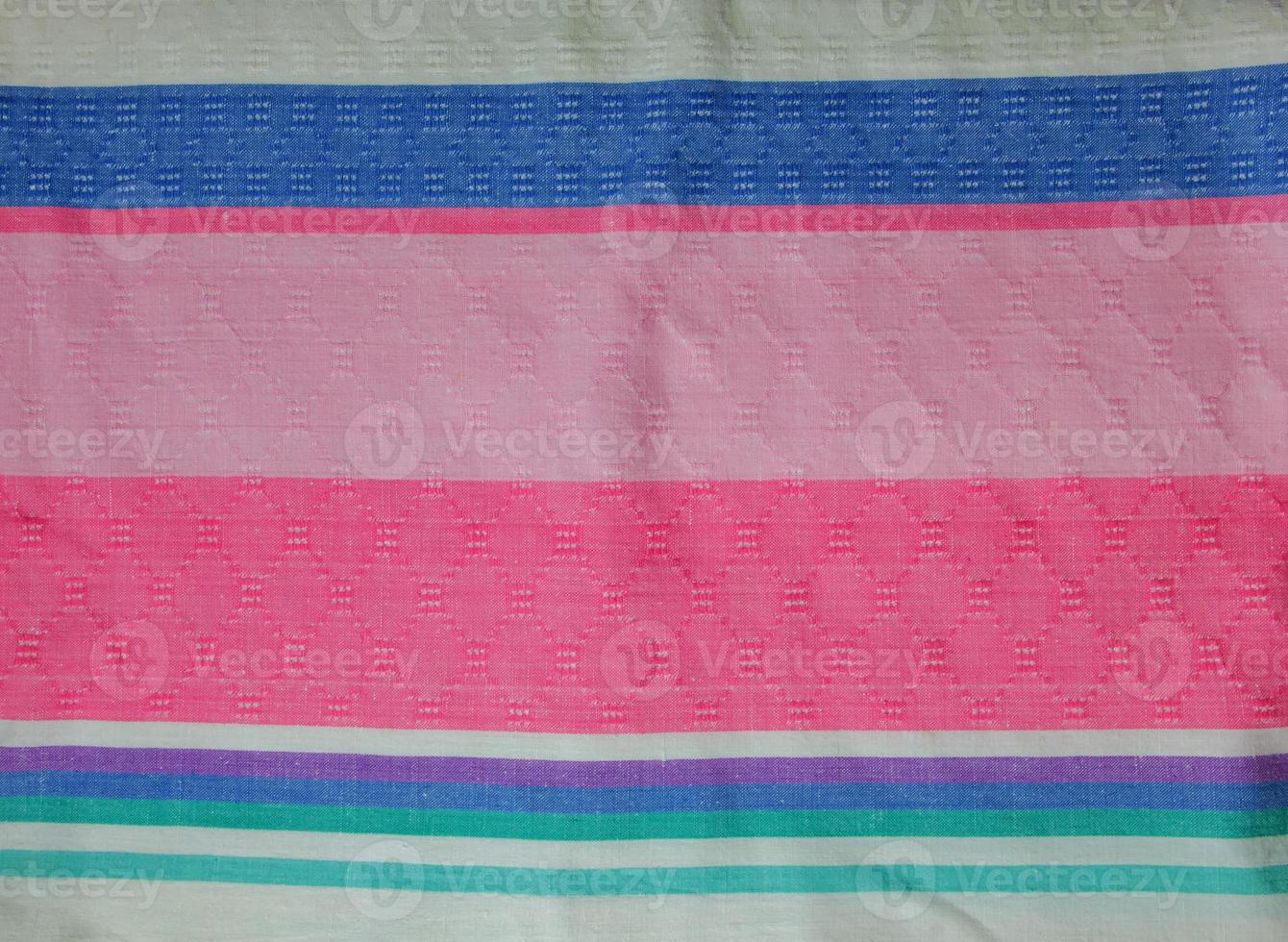 Closeup detail of multi color fabric texture samples. photo
