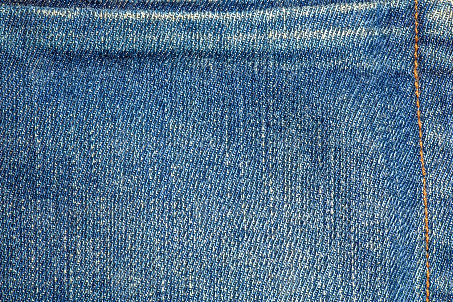 Textured old blue worn jeans - trendy jeans design. Details. photo