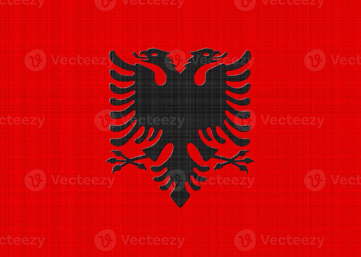 bandera de albania sobre un fondo texturizado. collage de conceptos foto