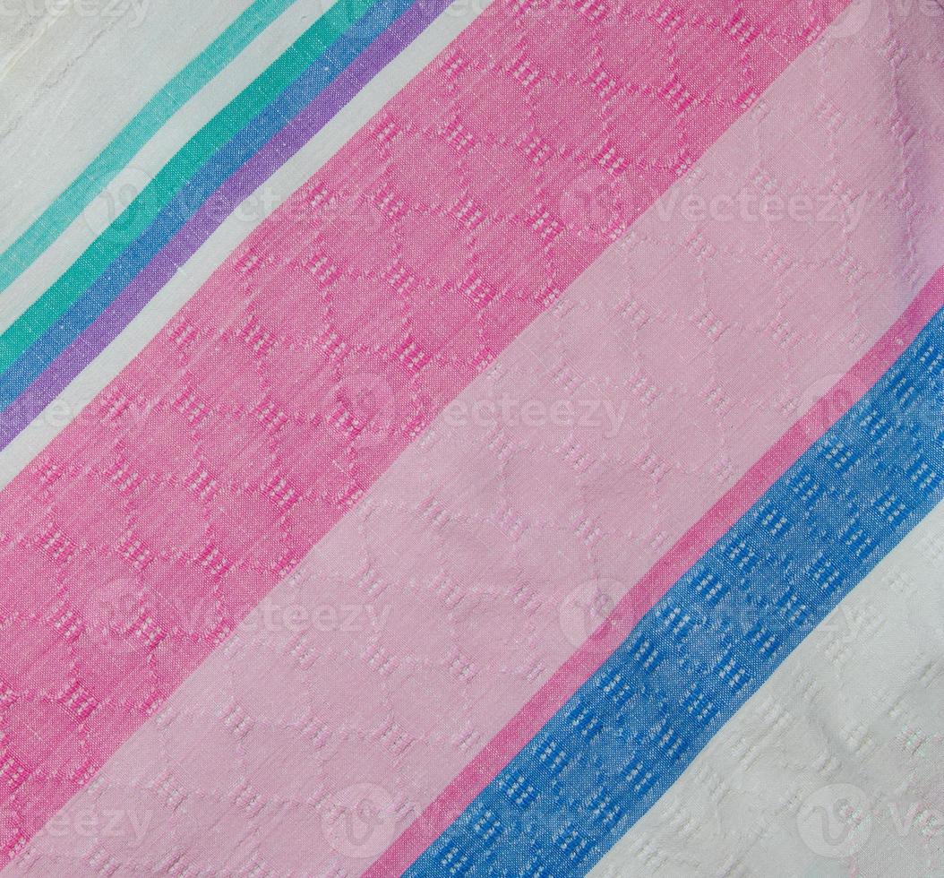 Closeup detail of multi color fabric texture samples. photo