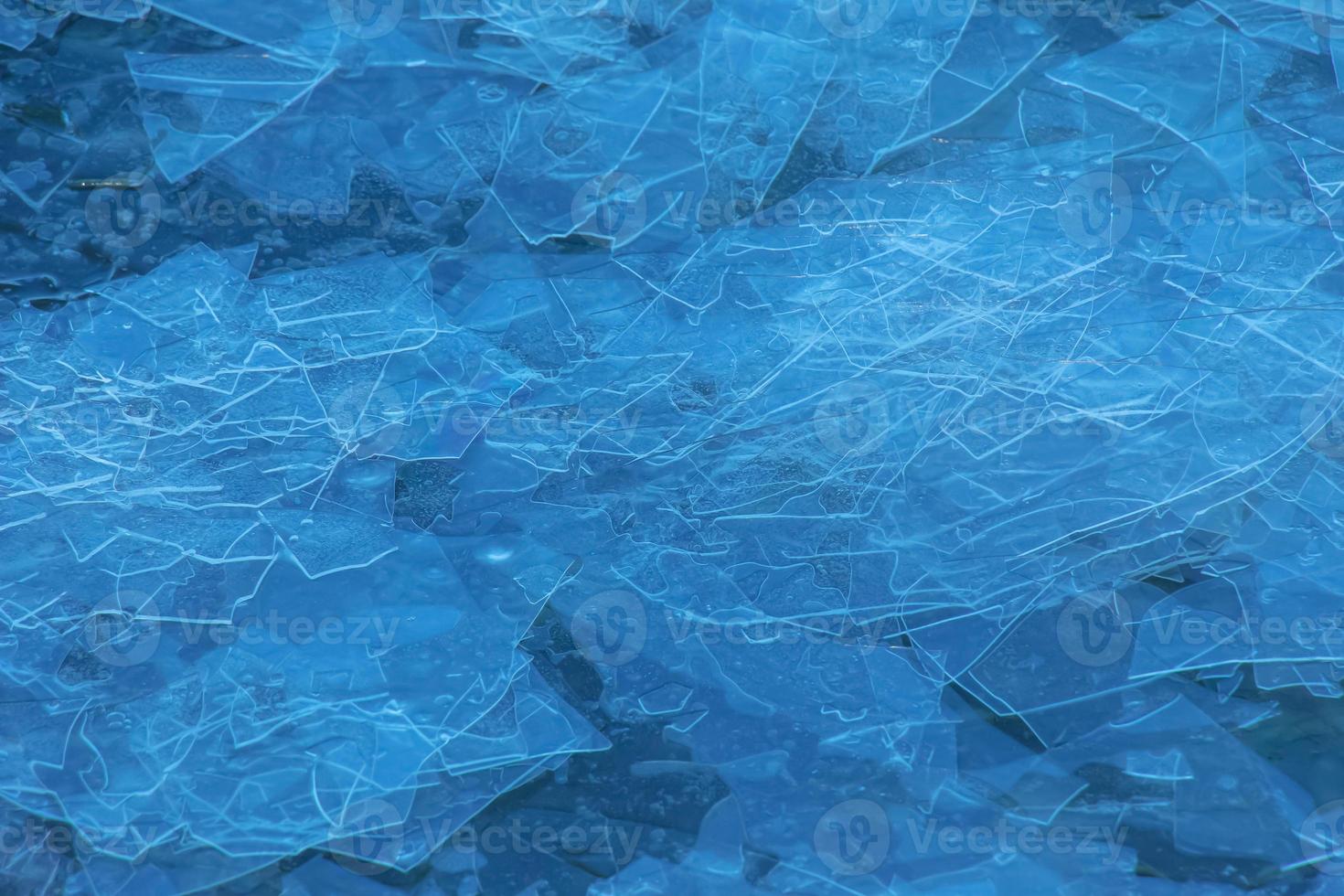 Ice surface of the river. Texture of ice shards. Winter background. photo