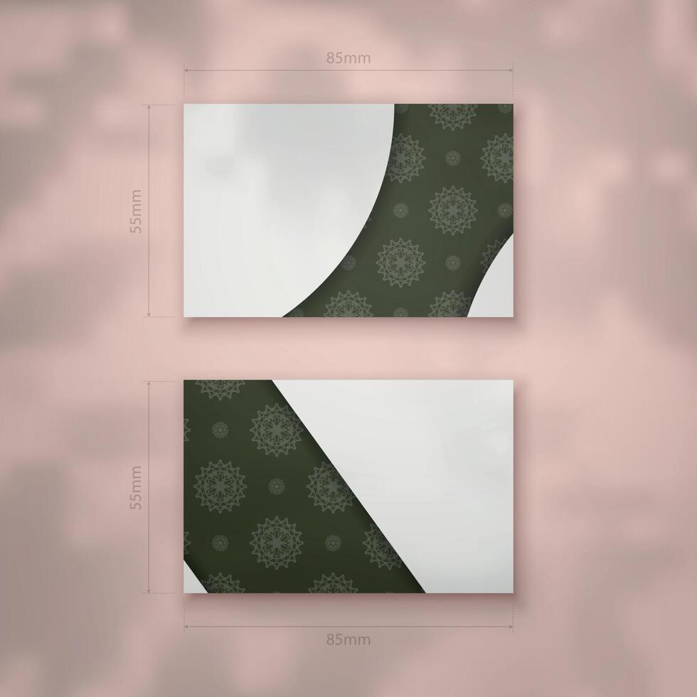 Dark green business card with Greek white pattern for your business. vector