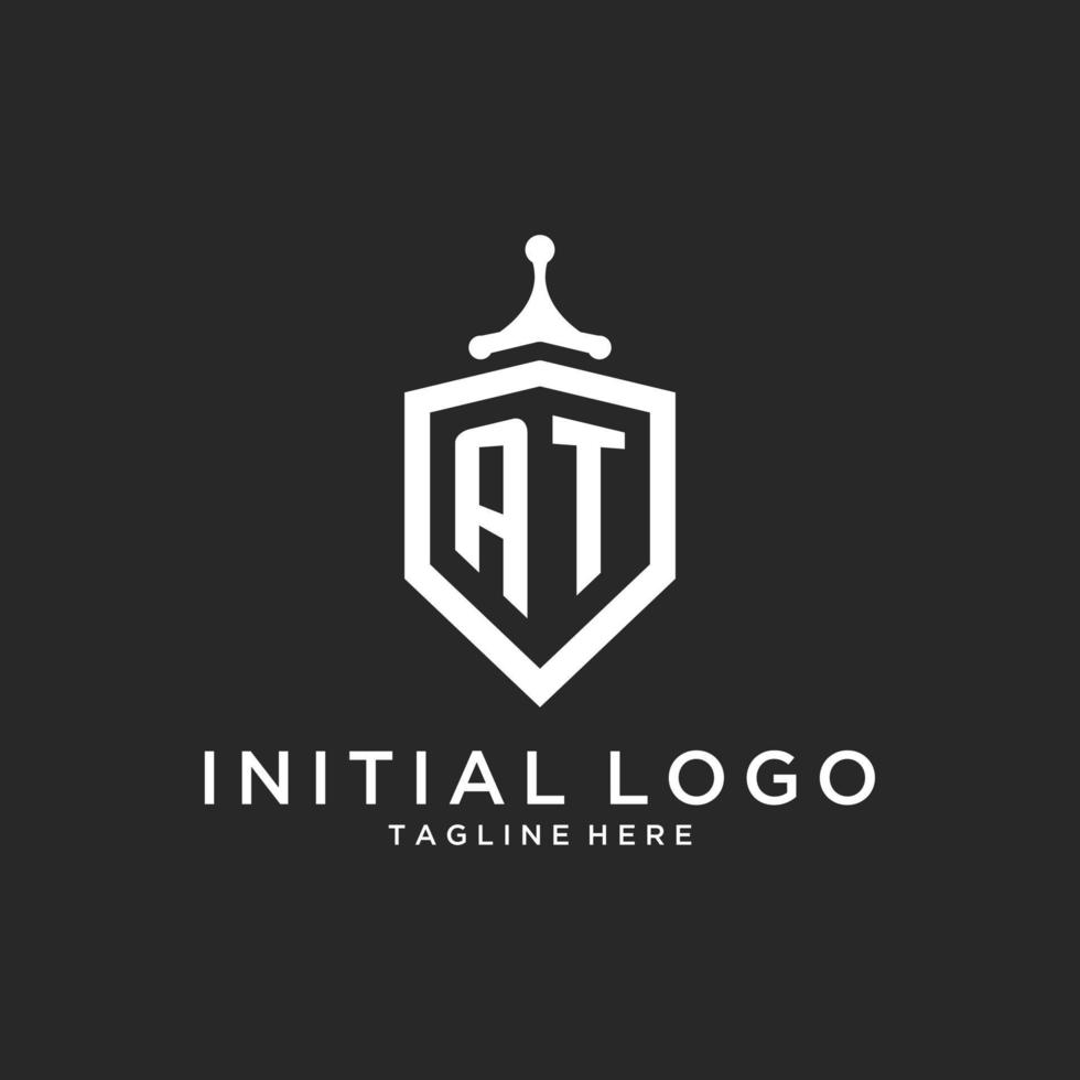 AT monogram logo initial with shield guard shape design vector