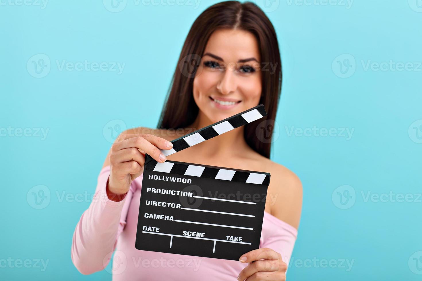 Woman against blue wall background photo