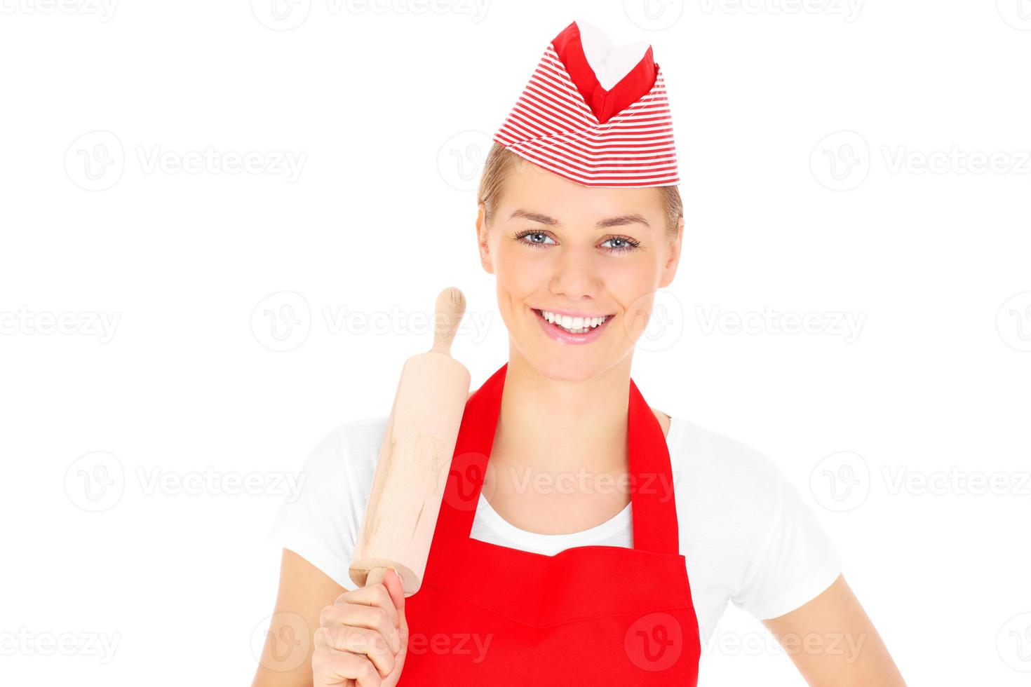 Happy woman with a rolling pin photo