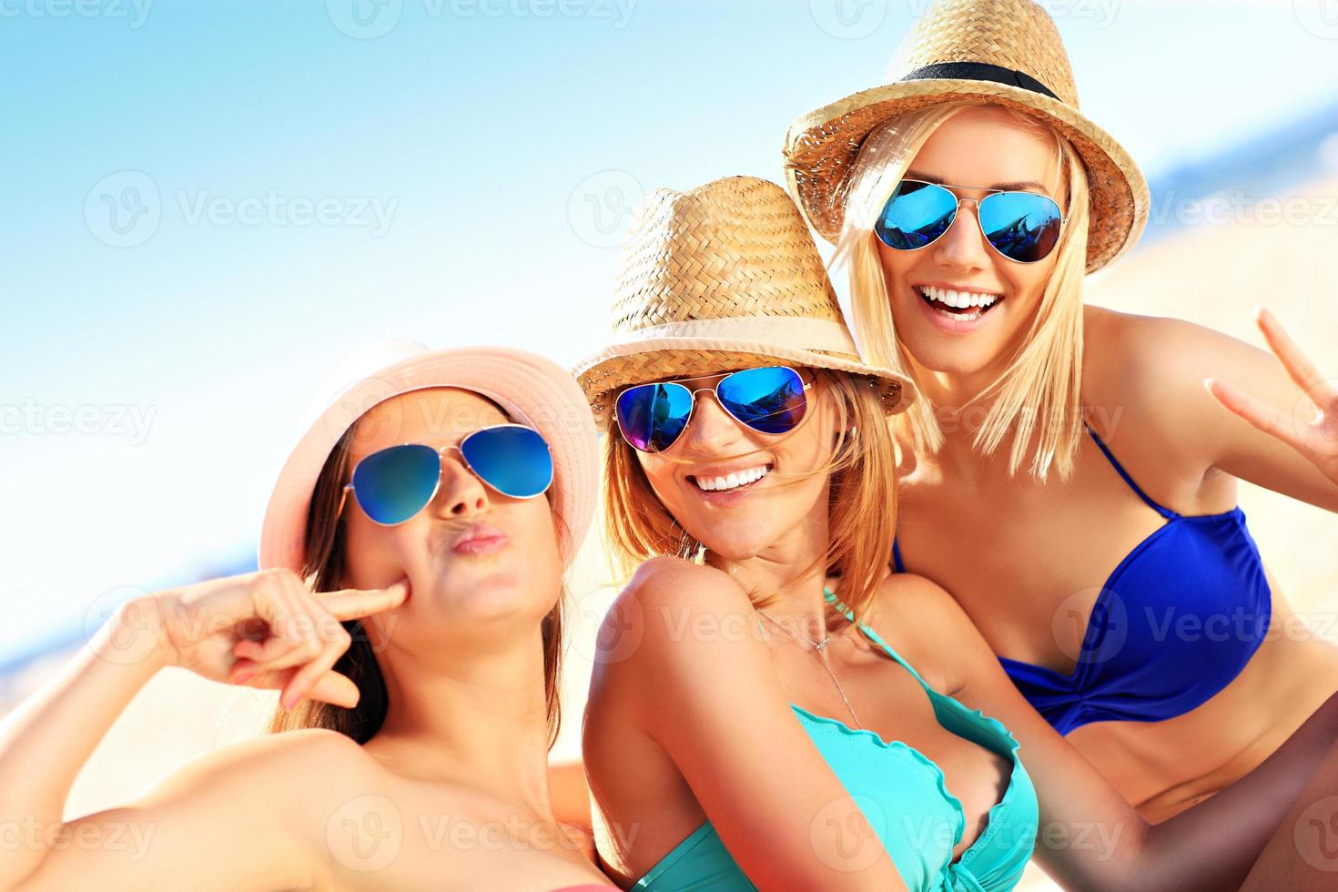 Group of women having fun on the beach photo