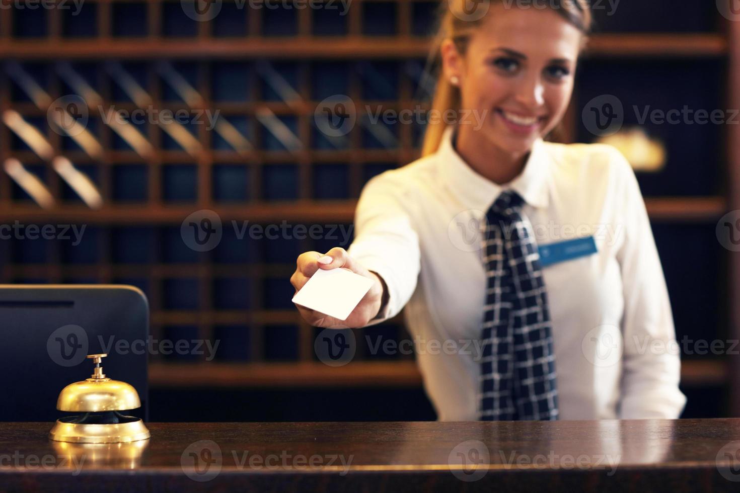 Receptionist with key card photo