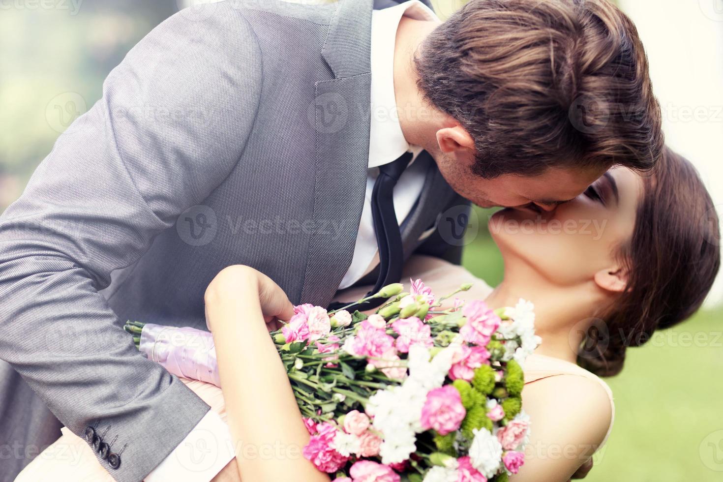 Beautiful wedding couple enjoying wedding photo