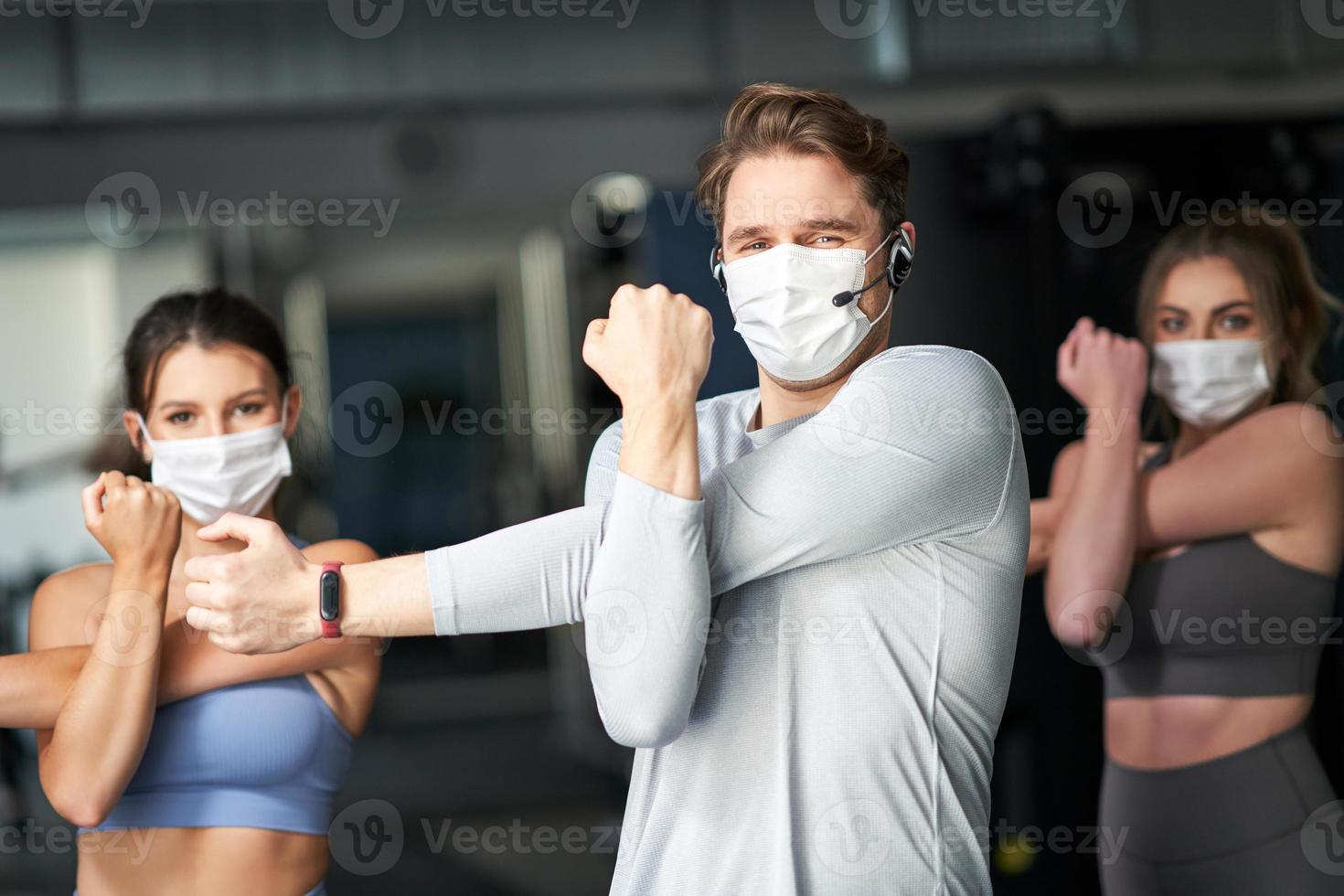 Group of people wearing masks working out in a gym 15811127 Stock Photo