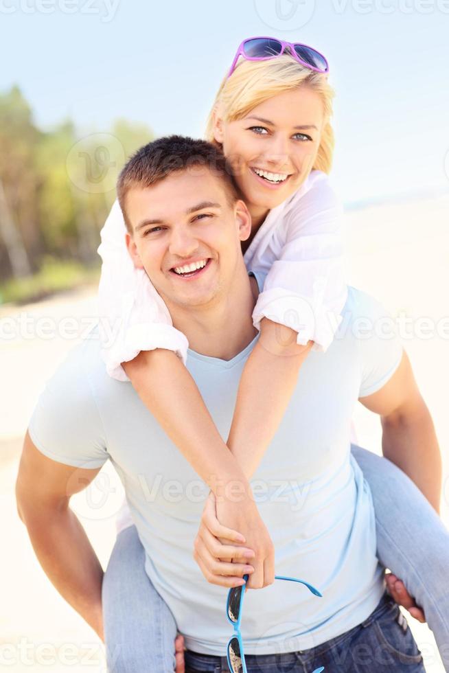 Piggyback at the beach photo