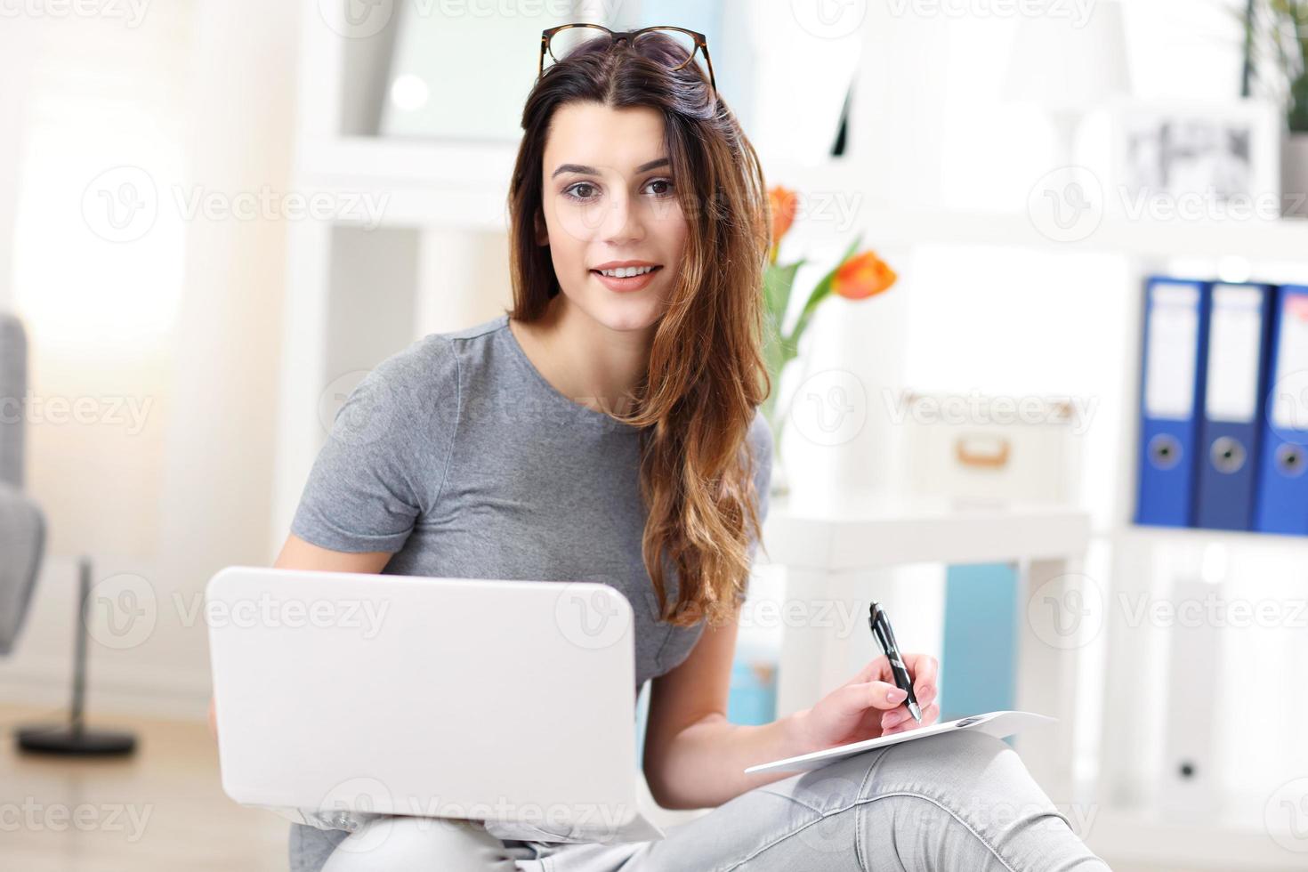 Woman working in her home office photo