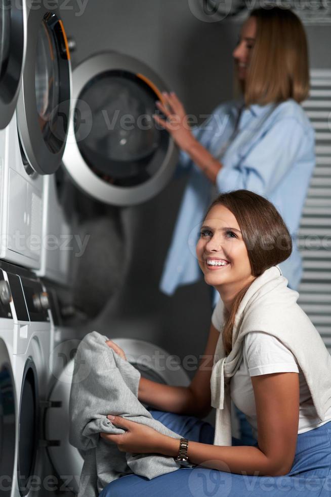 Two students in laundry room photo