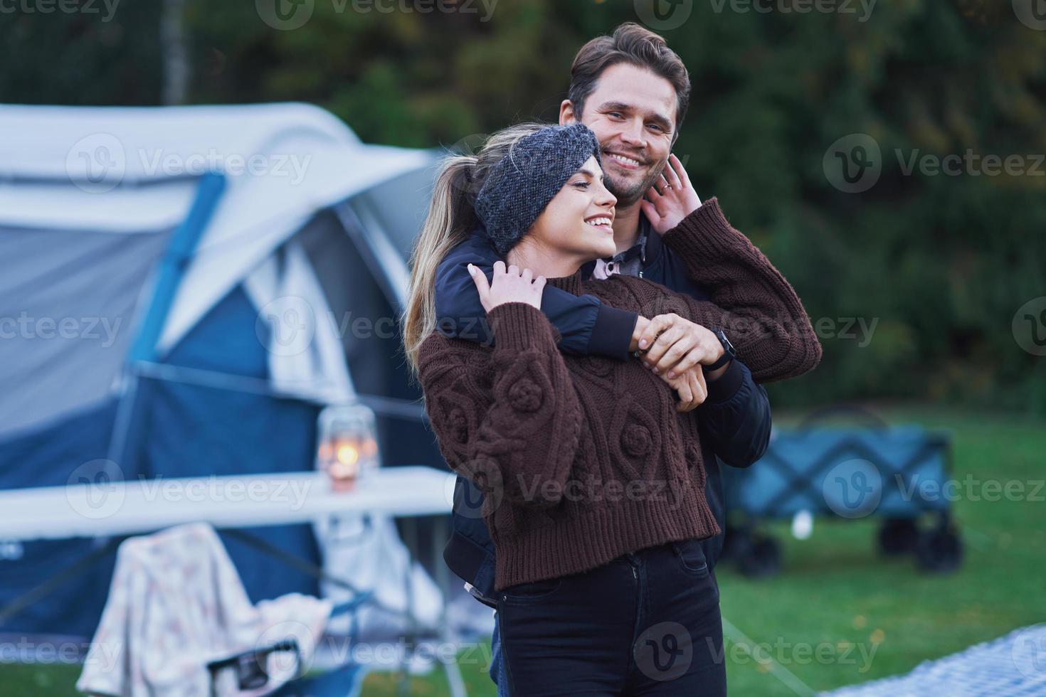 Young nice couple having fun on camping photo