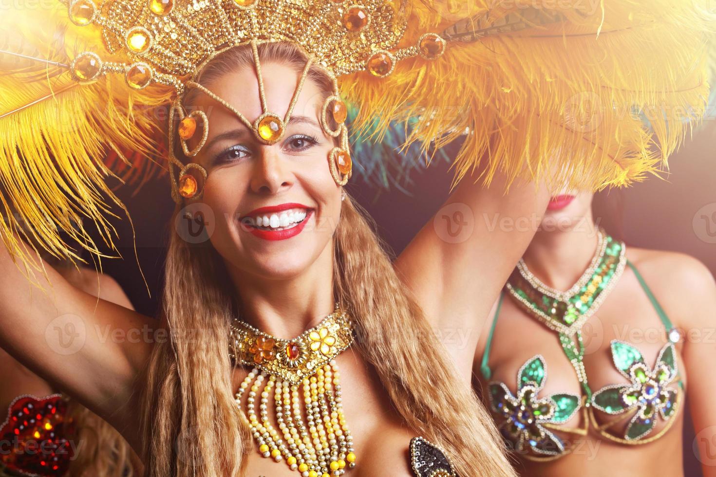 Brazilian women dancing samba at carnival photo