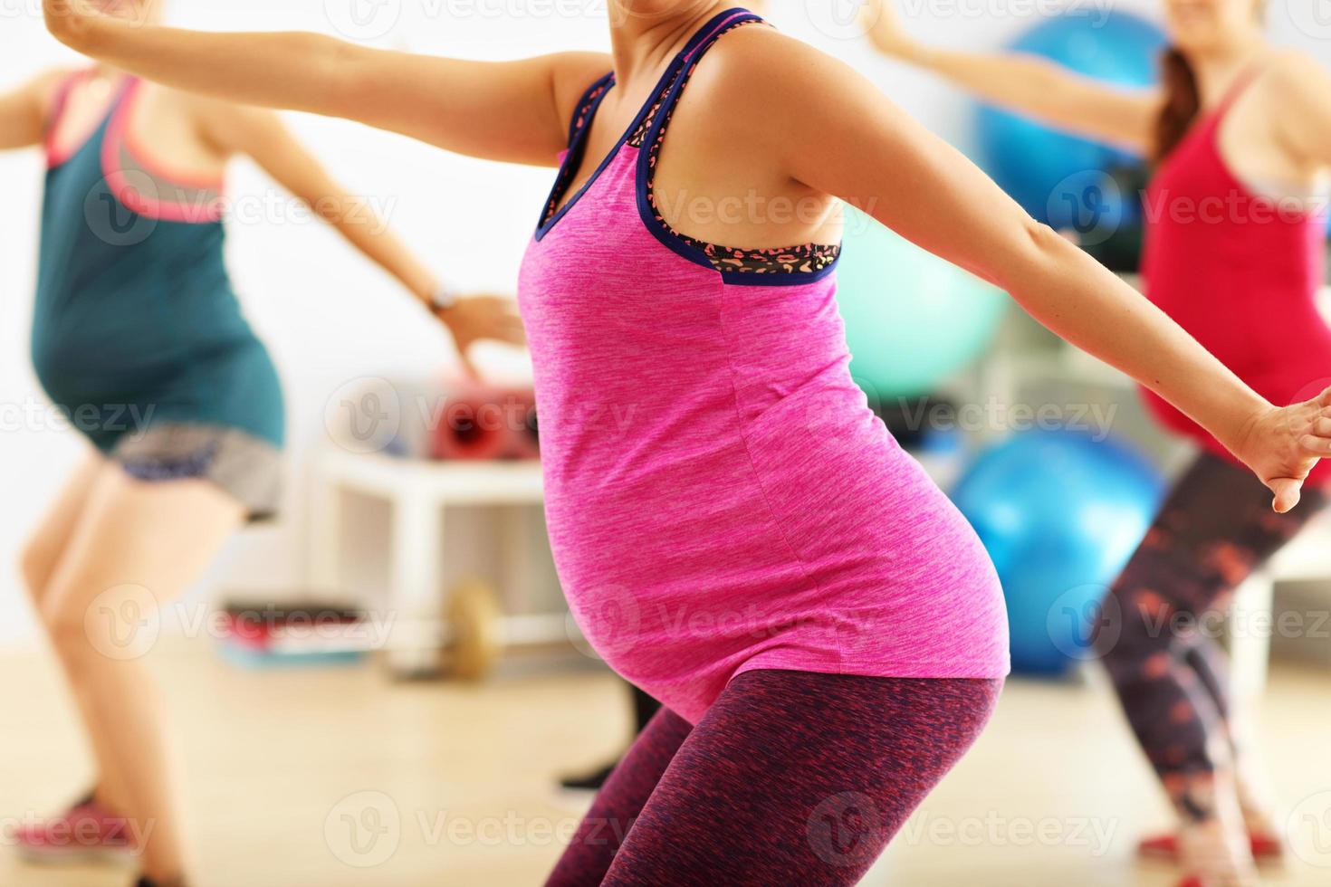 Group of pregnant women during fitness class photo