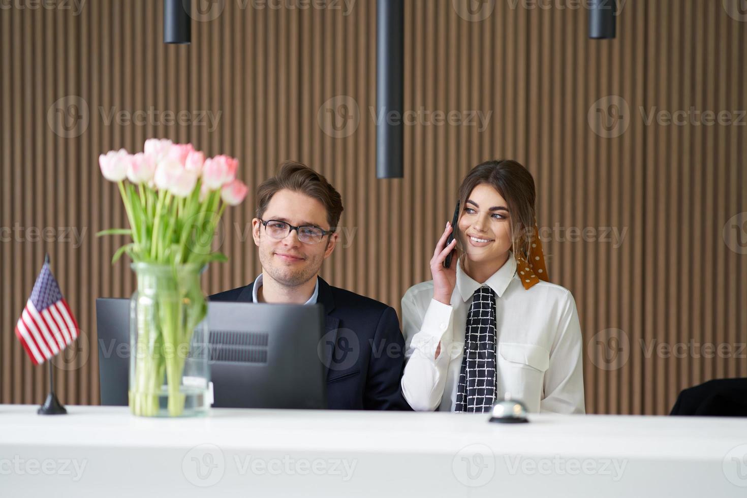 Receptionist working in a hotel photo