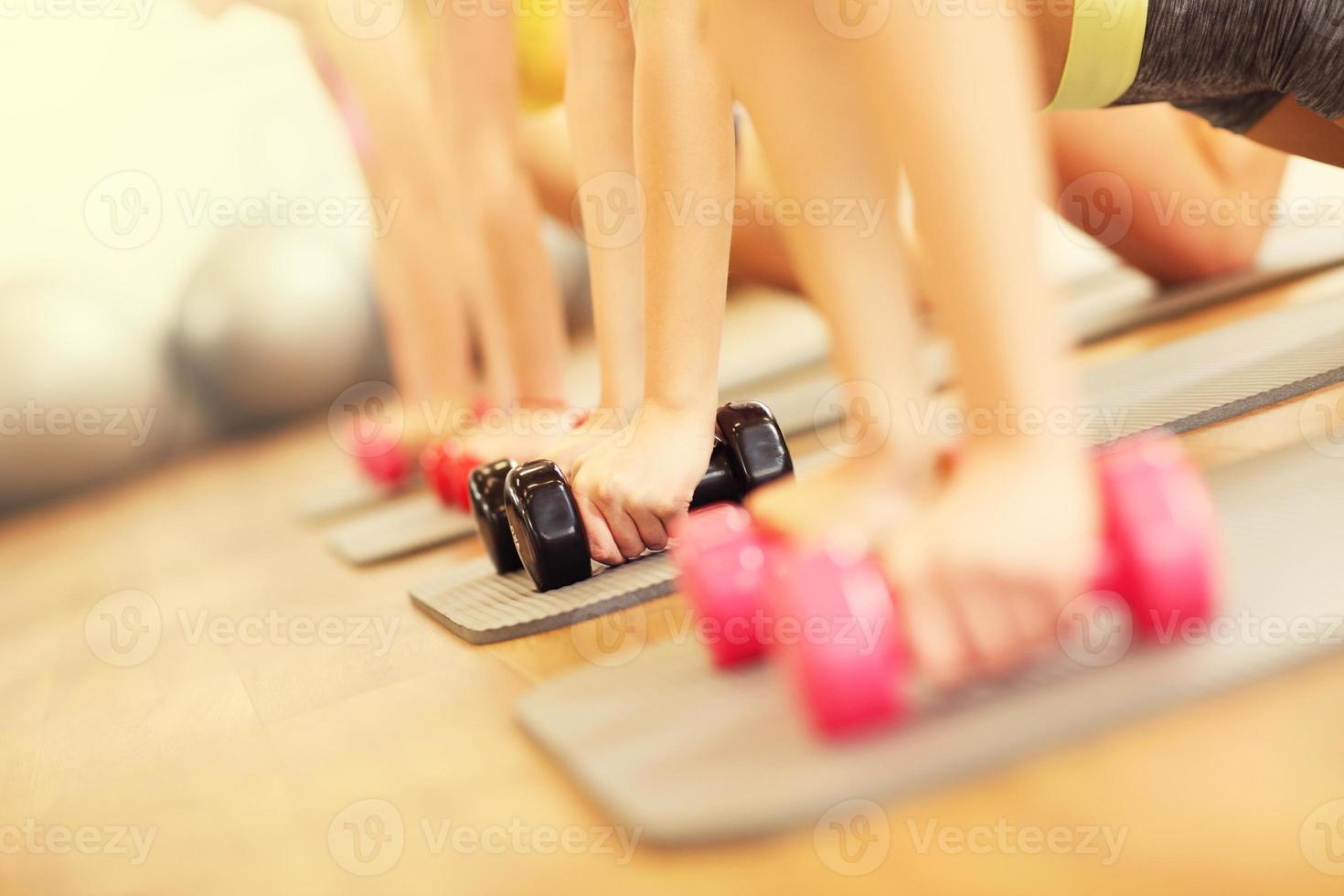 Group of women working out in gym photo
