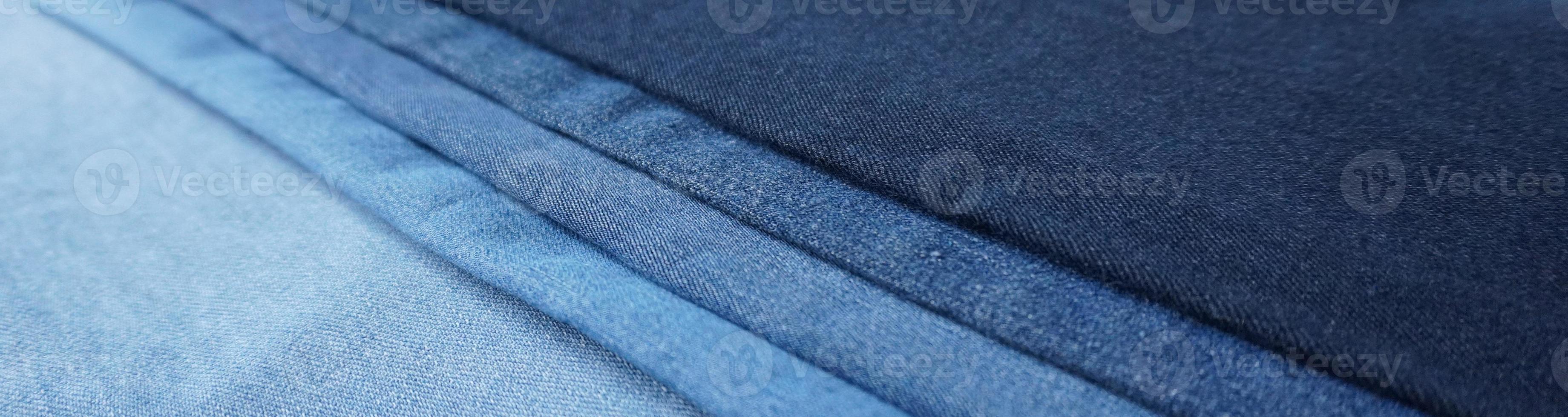 Denim fabric light to dark different shades abstract background photo