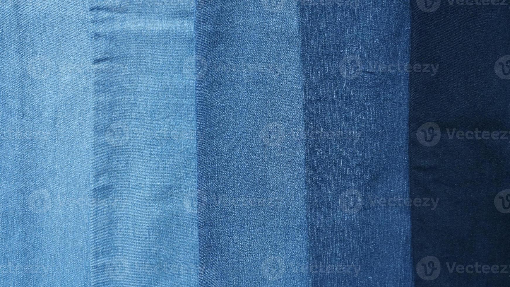 Denim fabric light to dark different shades abstract background photo