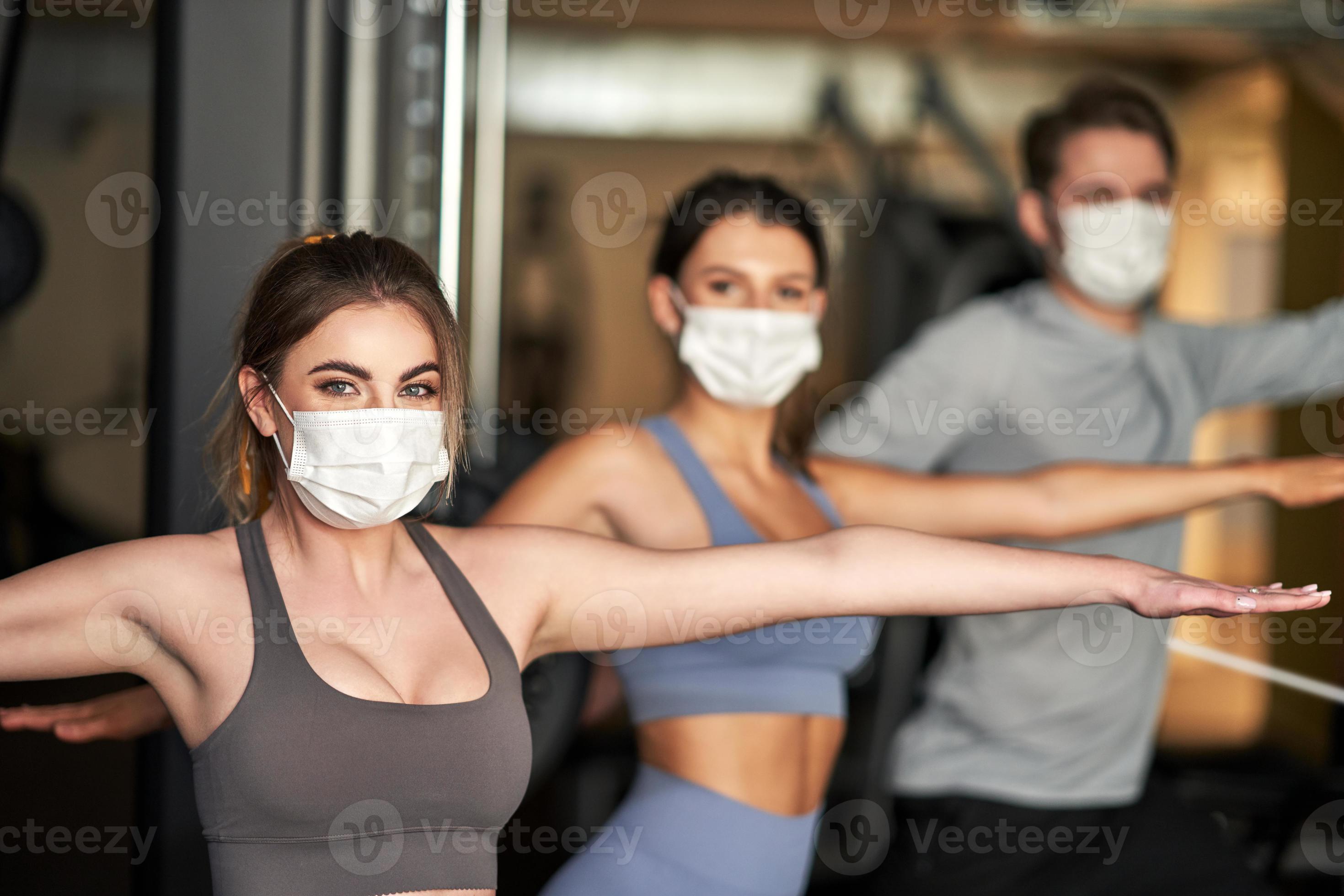 Group of people wearing masks working out in a gym 15812579 Stock Photo