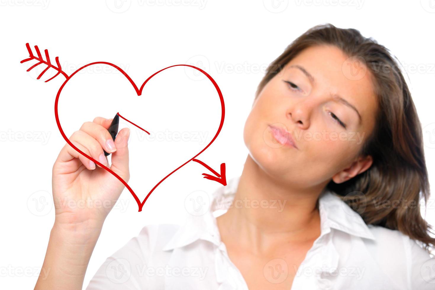 Woman drawing a heart photo