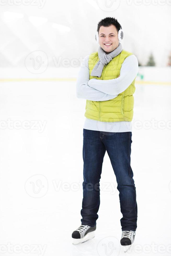 Cheerful man on a skating rink photo