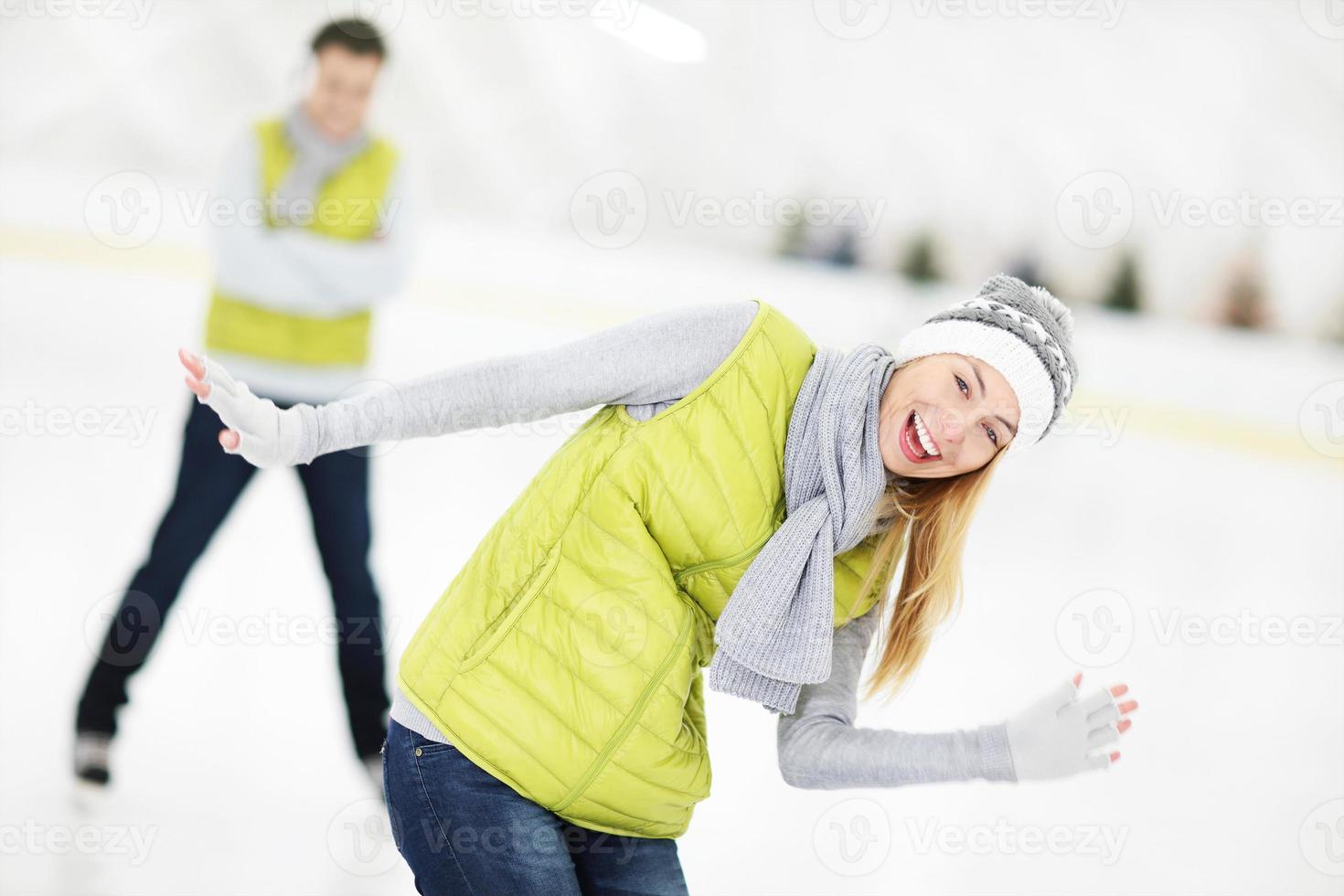 Cheerful couple in the skating rink photo