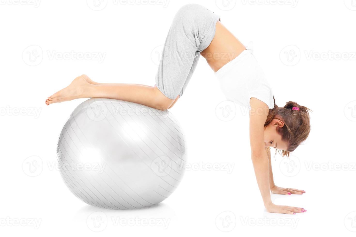 Woman exercising with a ball photo