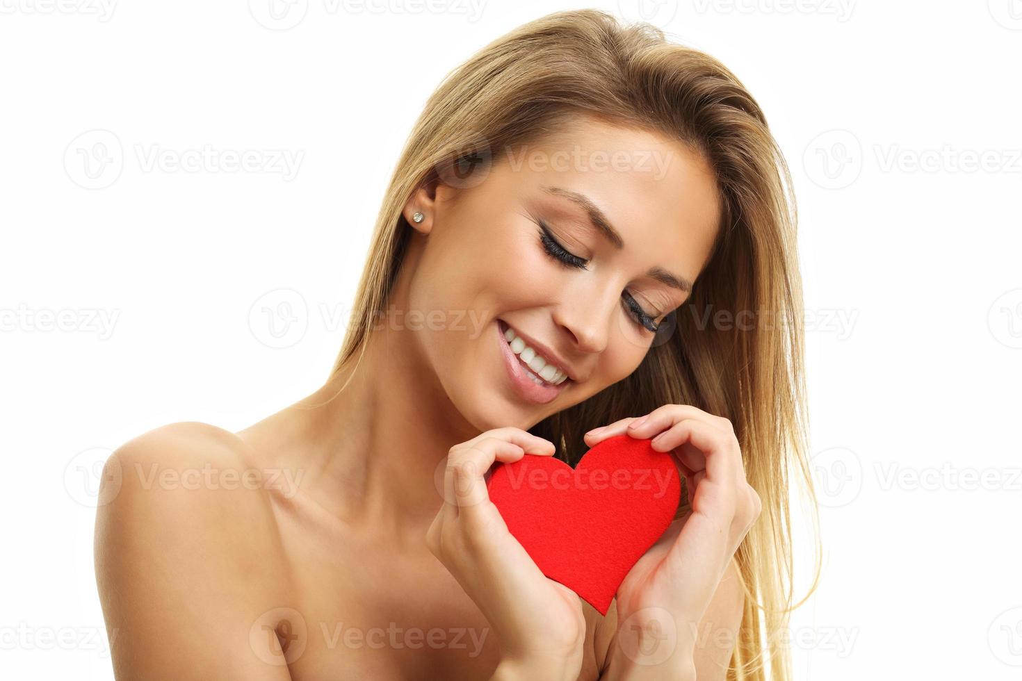 Beautiful woman posing with heart photo