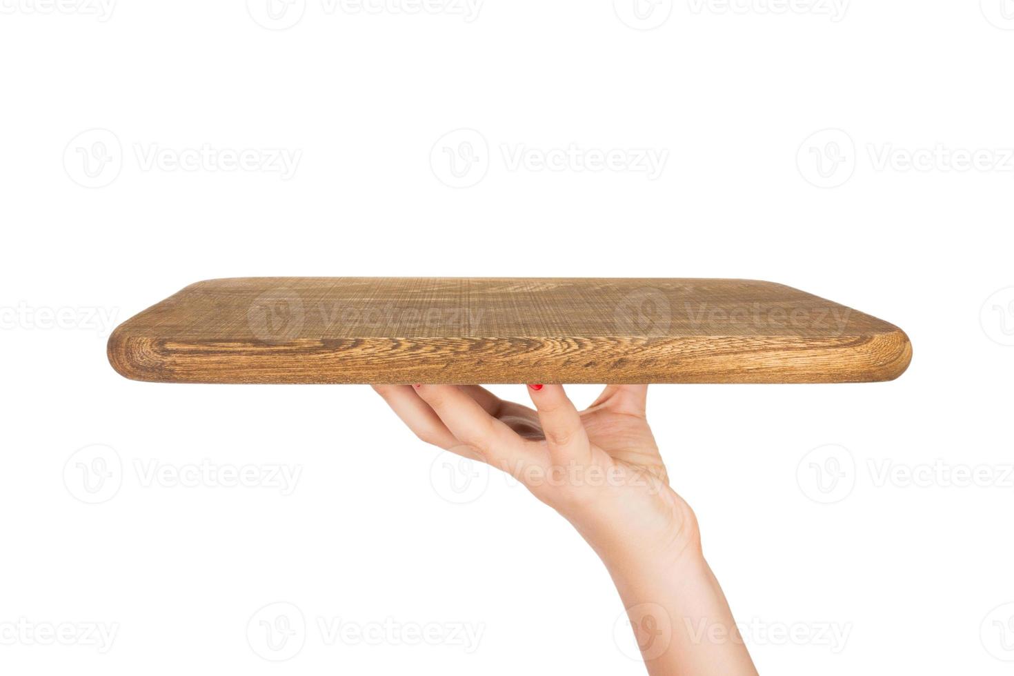 Hand holding wooden board isolated on white background with copy space. perspective view, isolated on white background photo
