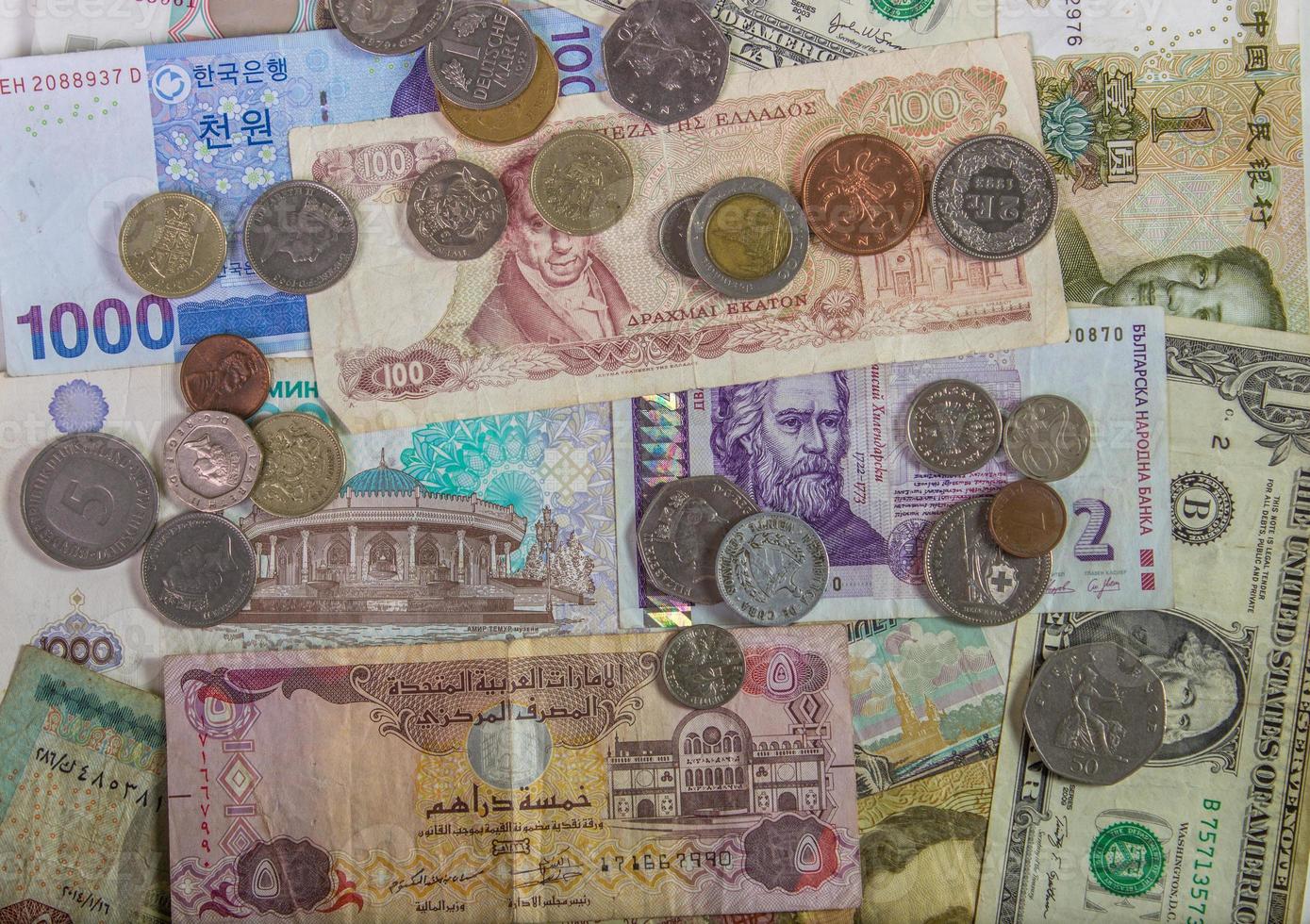 Colorful background of many currency banknotes. photo