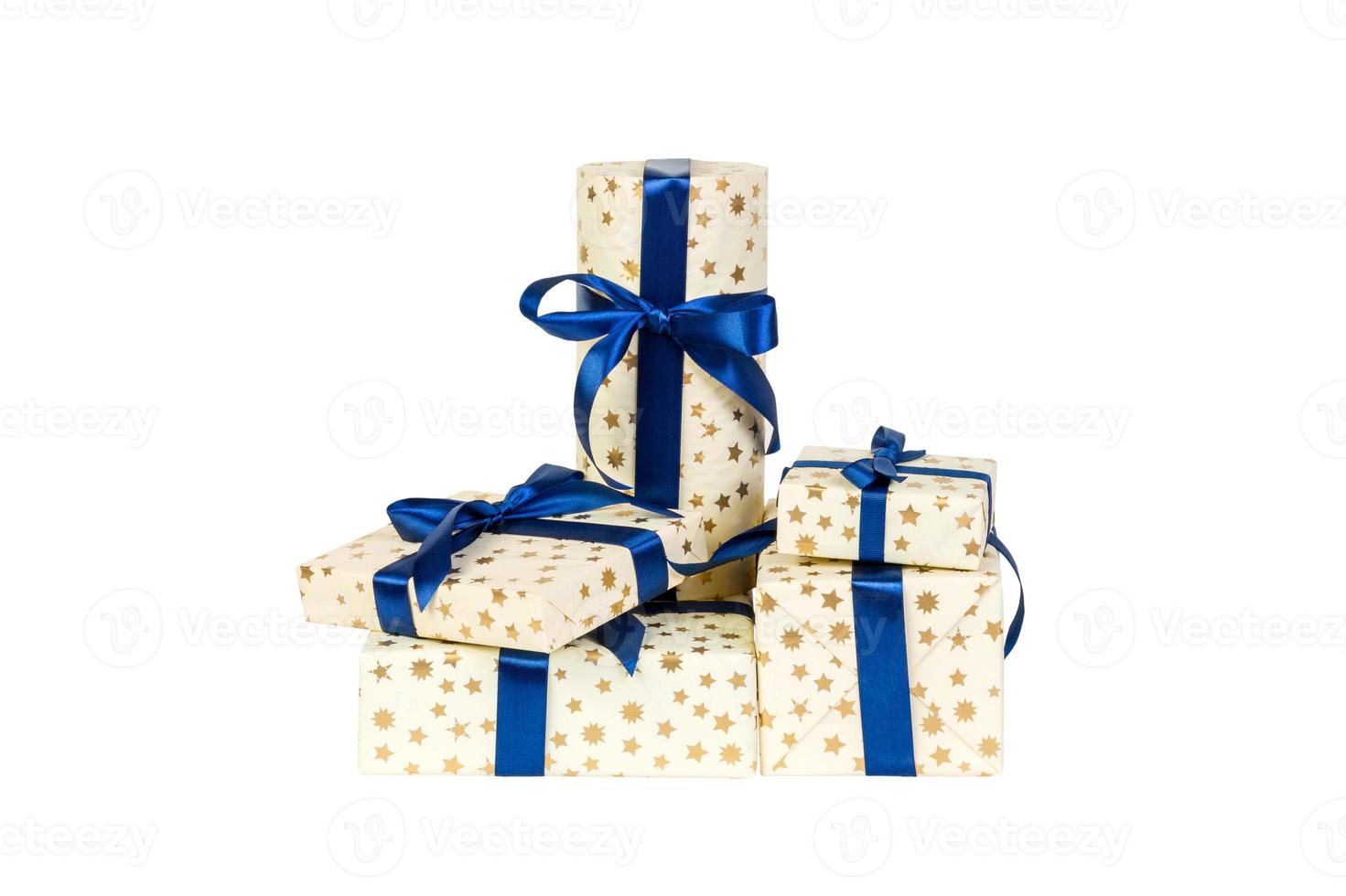 Set of Christmas or other holiday handmade present in gold paper with blue ribbon. Isolated on white background, top view. thanksgiving Gift box concept photo