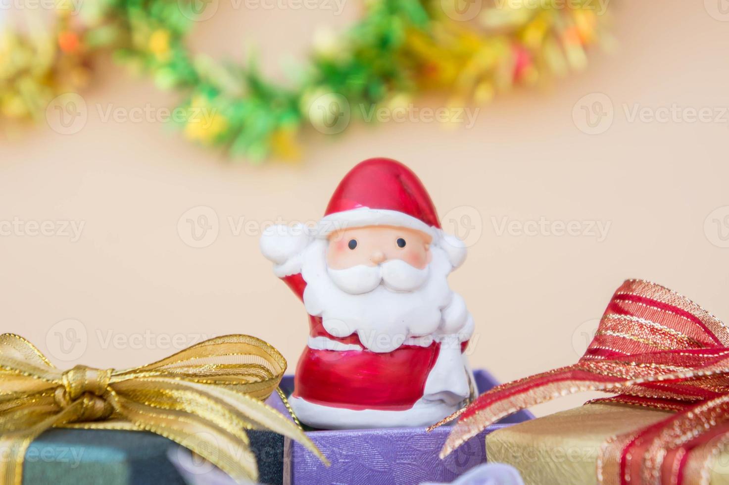santa claus doll christmas background and gift box and copy space photo