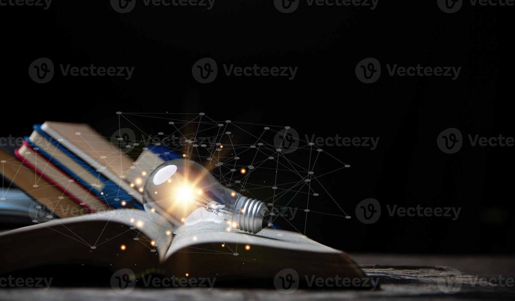 Light bulbs and books. Concept of reading books, knowledge, and searching for new ideas. Innovation and inspiration, Creativity with twinkling lights, the inspiration of ideas. photo