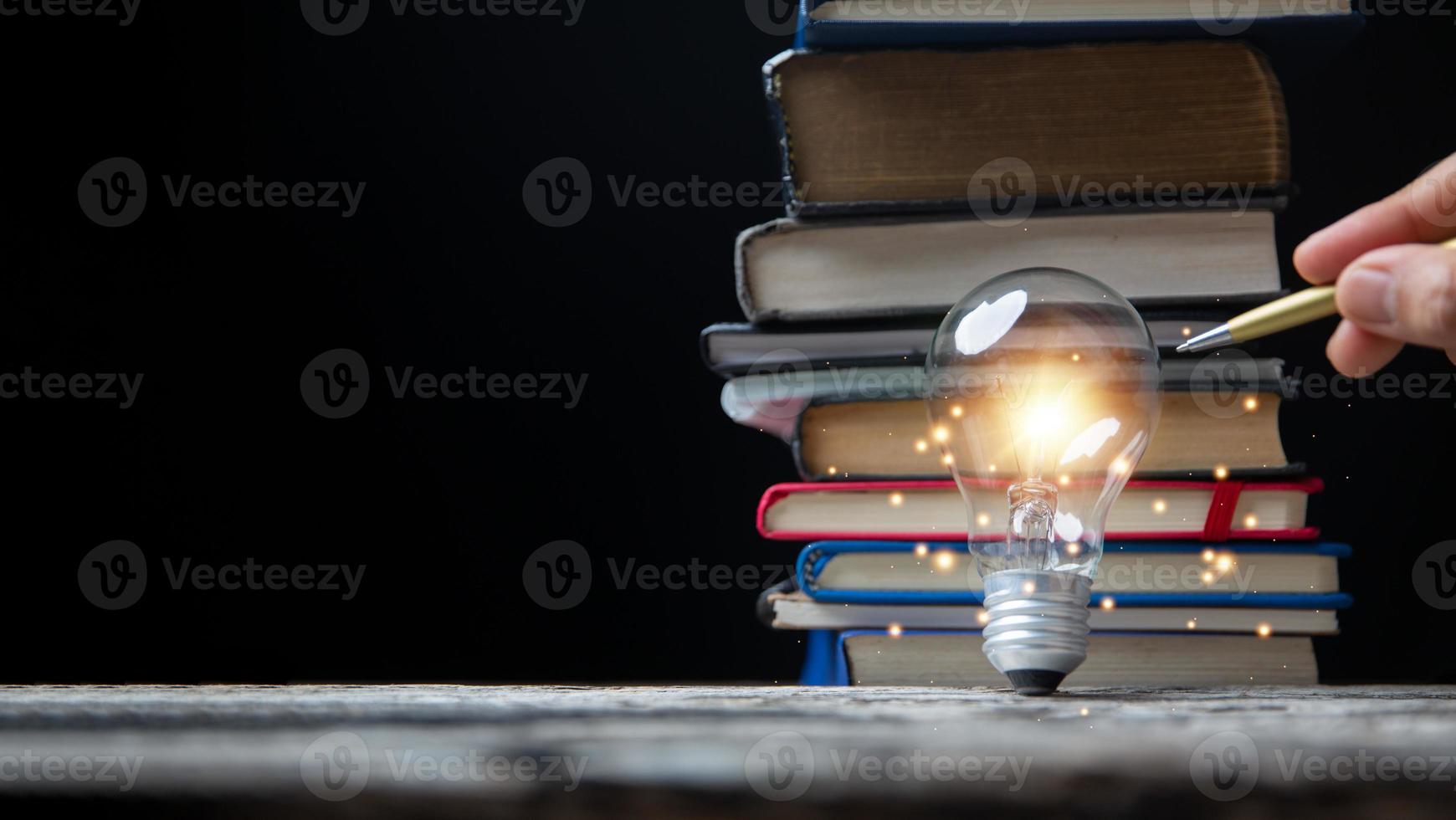 Light bulbs and books. Concept of reading books, knowledge, and searching for new ideas. Innovation and inspiration, Creativity with twinkling lights, the inspiration of ideas. photo