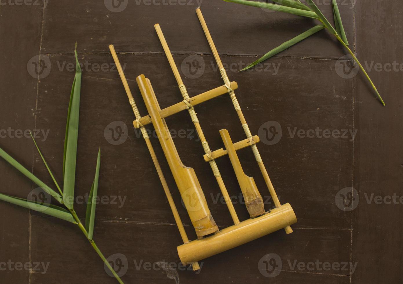 Angklung, the traditional sundanese musical instrument made from bamboo. Isolated on white background photo