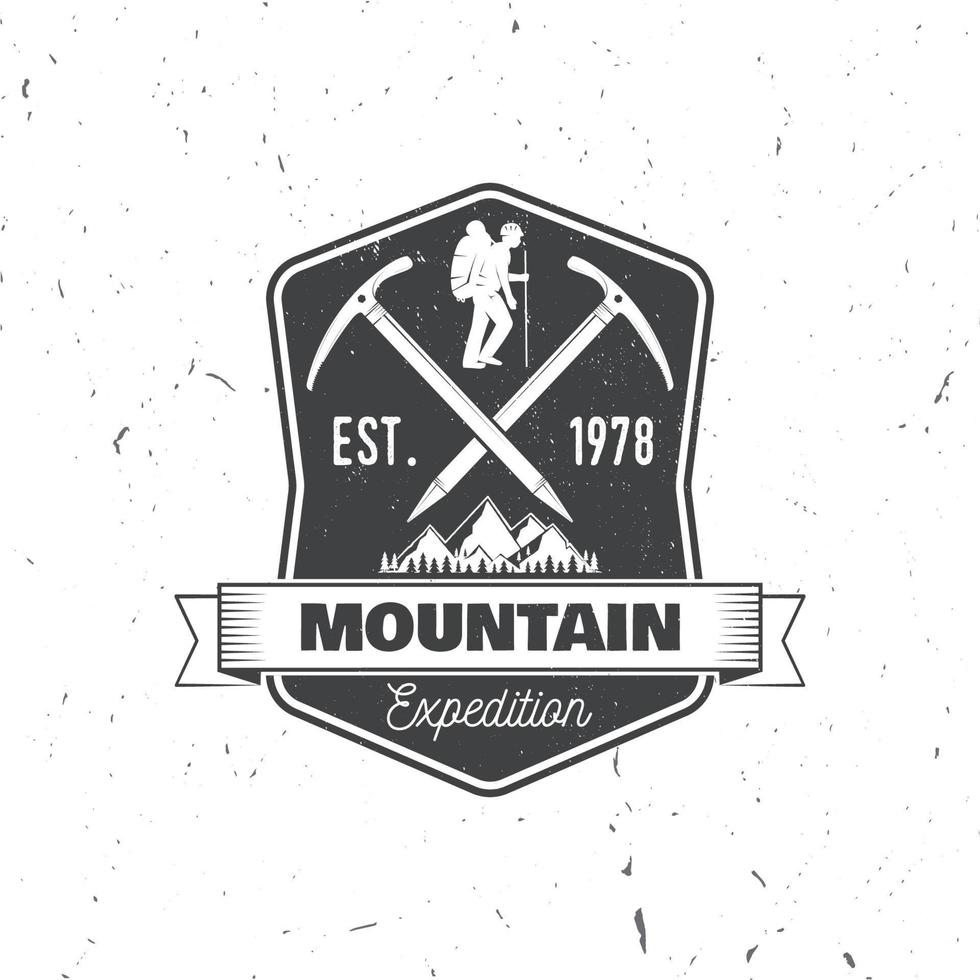 Vintage typography design with ice ax and mountain silhouette. vector