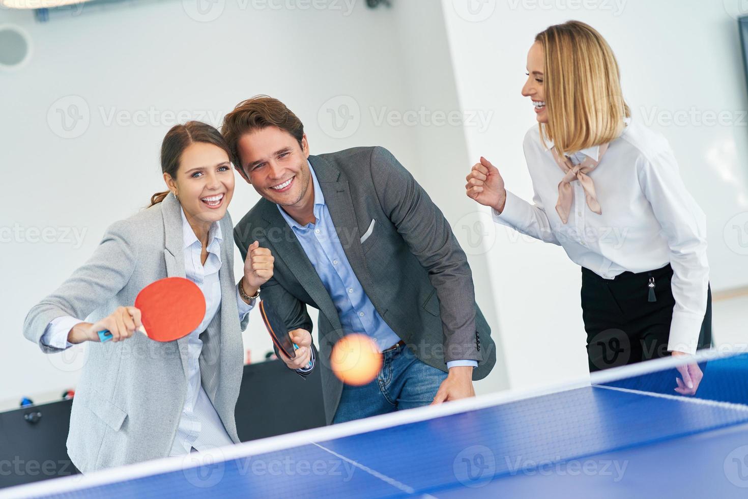 Business people relaxing in shared office space photo