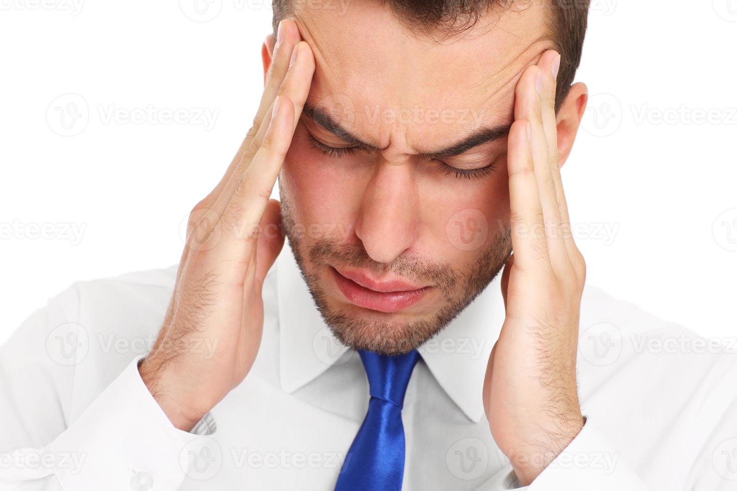 Businessman suffering from headache photo
